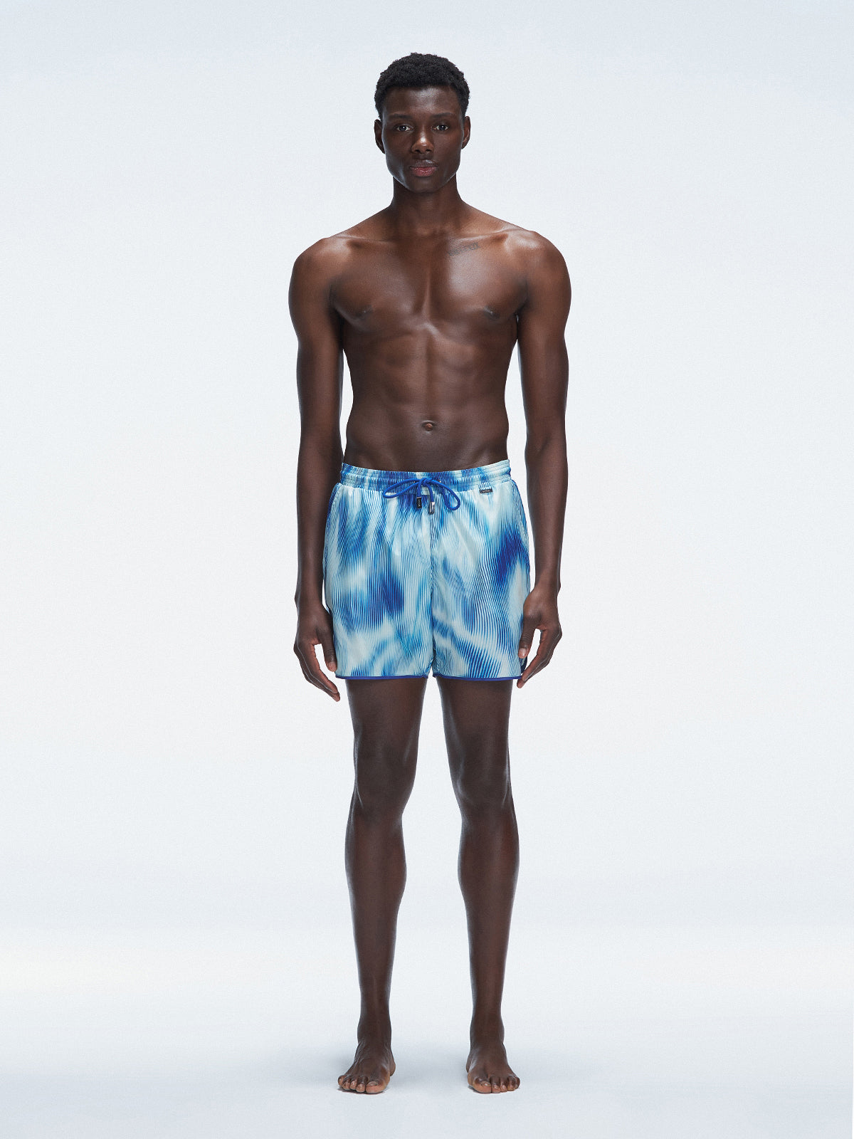 Griffin Blue Sonar Swim Shorts with front tie cords and side piping, laid flat for a detailed view.
