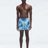 Griffin Blue Sonar Swim Shorts with front tie cords and side piping, laid flat for a detailed view.
