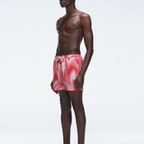 Model showcasing Griffin Red Sonar Swim Shorts with side piping detail and a secure elastic waistband.
