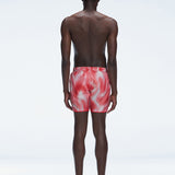 Back view of Griffin Red Sonar Swim Shorts on a model, displaying the vibrant print and functional details.
