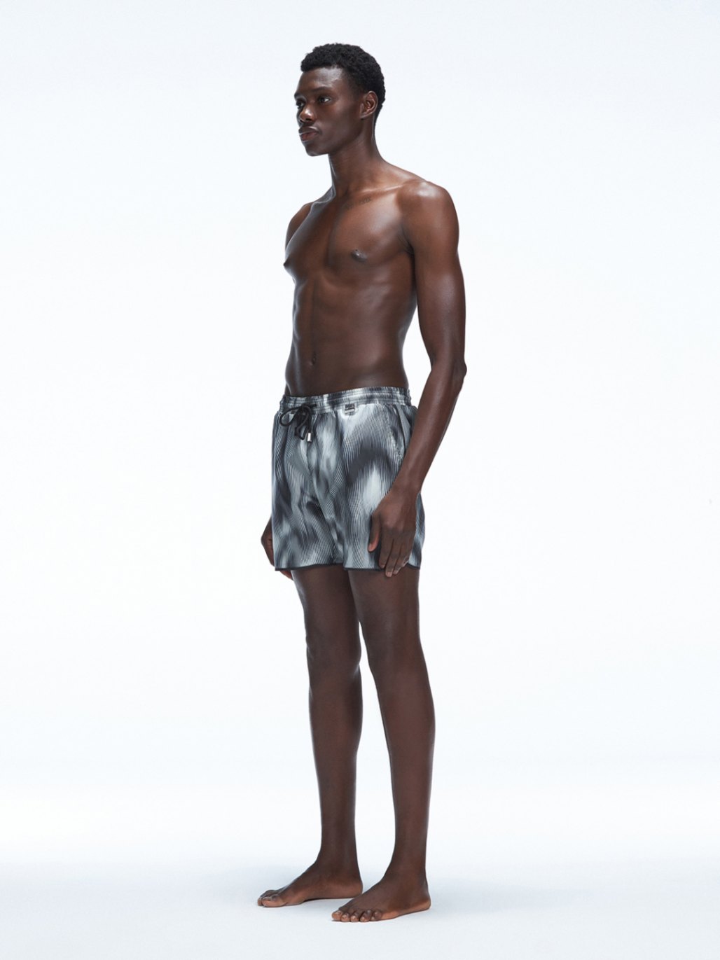 Griffin Black Sonar Swim Shorts, close-up of side piping and tie cords on the elasticated waistband.
