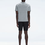 Back view of the model wearing the Atticus Grey Polo T-Shirt, showcasing the slim fit and short sleeves.
