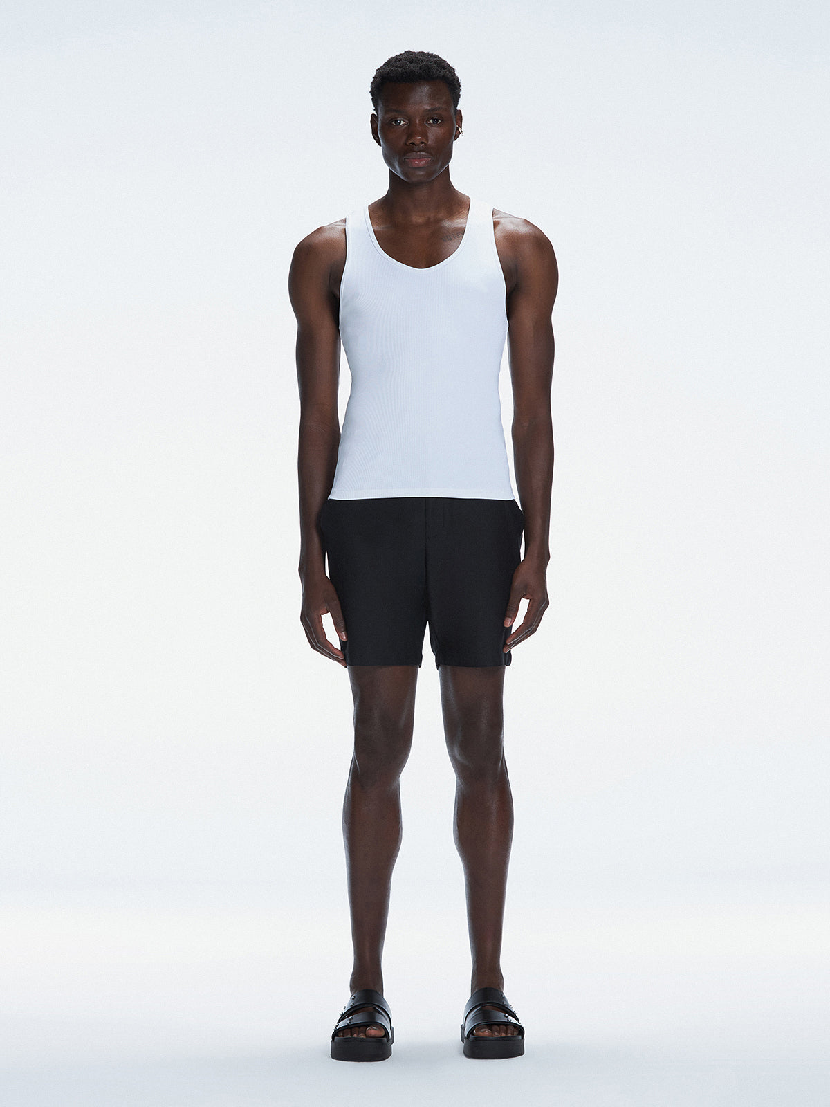 Model wearing the Phillip White Tank Top, showcasing the tailored fit and minimalist design.