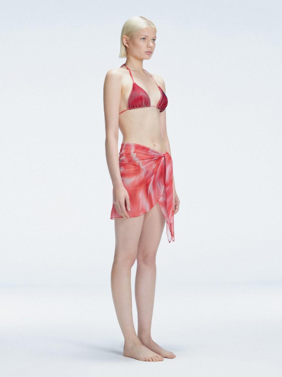 Side view of the front tie closure on the Evita Red Sarong, highlighting its stylish design."