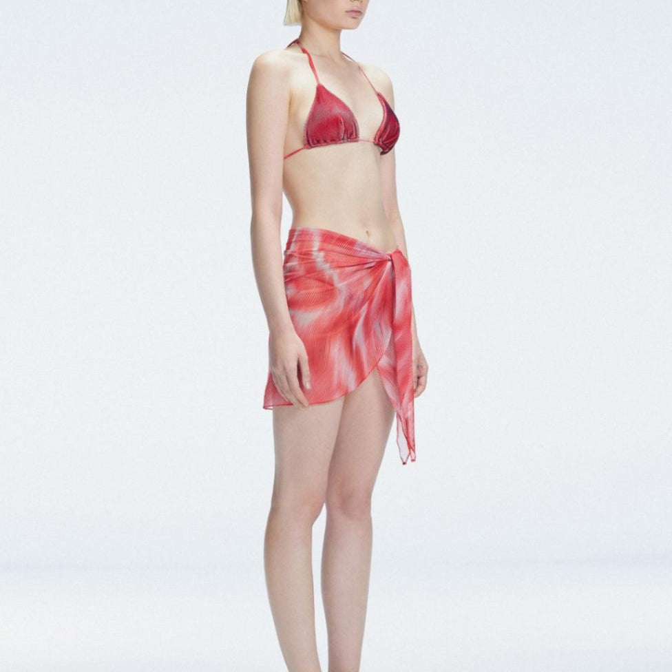 Evita Red Optical Tie Side Sarong | Moeva | Sarong | Each week unveils new pieces—luxury swimwear, fluid resort silhouettes, and elevated summer-to-evening essentials designed to carry you from coastal escapes to city nights.