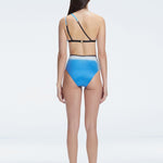 Back view of model wearing Eva Blue Optical Bikini Set, highlighting the high-waisted fit and full coverage.
