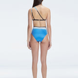 Back view of model wearing Eva Blue Optical Bikini Set, highlighting the high-waisted fit and full coverage.
