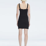 Back view of model wearing Heather Black Dress, highlighting the sleek silhouette and adjustable straps.
