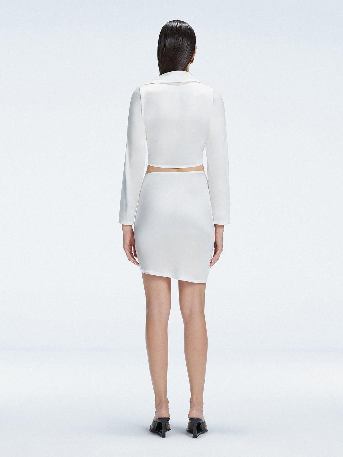 Back view of model wearing Greta White Shirt and Antonia White Skirt, highlighting the elegant cropped silhouette.
