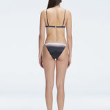 Back view of model wearing Rory Black Optical Bikini Set , highlighting the halterneck design and sleek fit.
