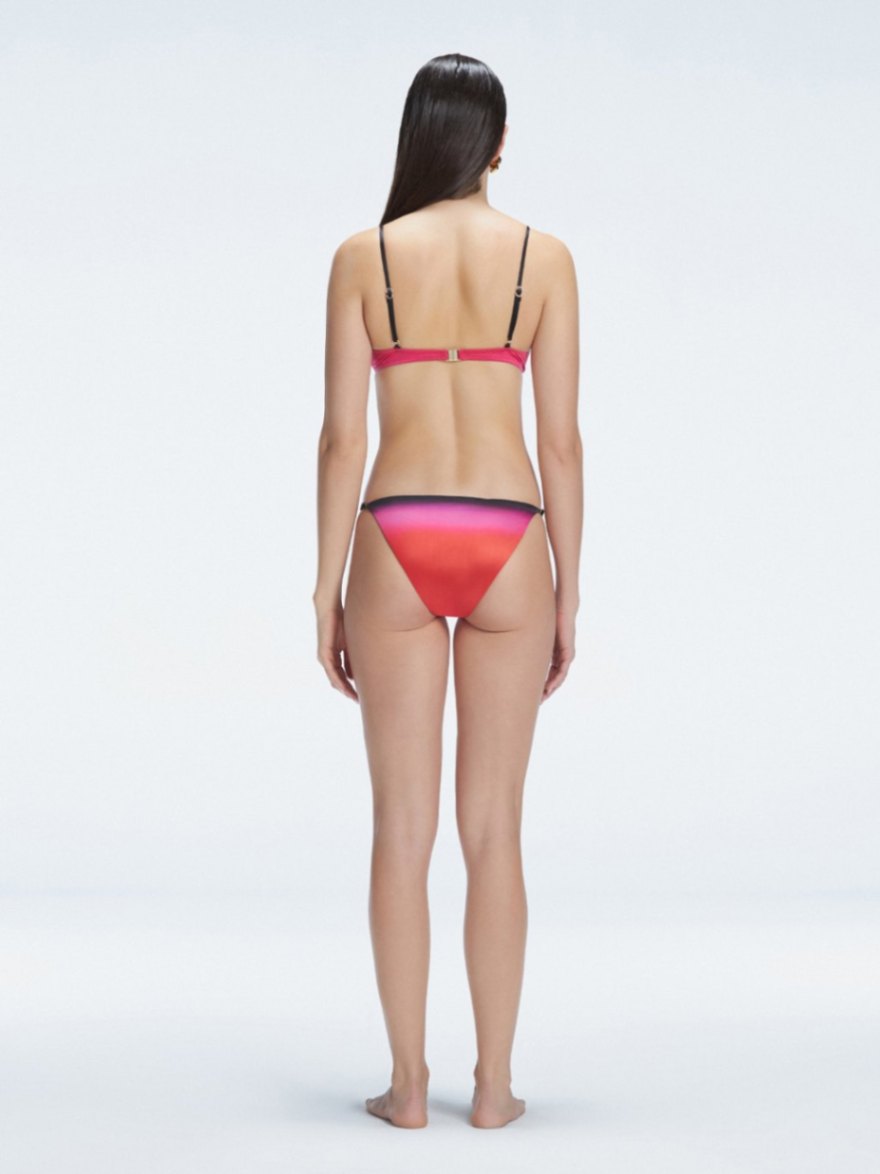 Back view of model wearing Rory Pink Optical Bikini Set , highlighting the halterneck design and sleek fit.
