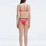 Back view of model wearing Rory Pink Optical Bikini Set , highlighting the halterneck design and sleek fit.
