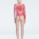 Back view of model wearing Mireya Red Optical Bodysuit, highlighting the sleek silhouette and long sleeves.
