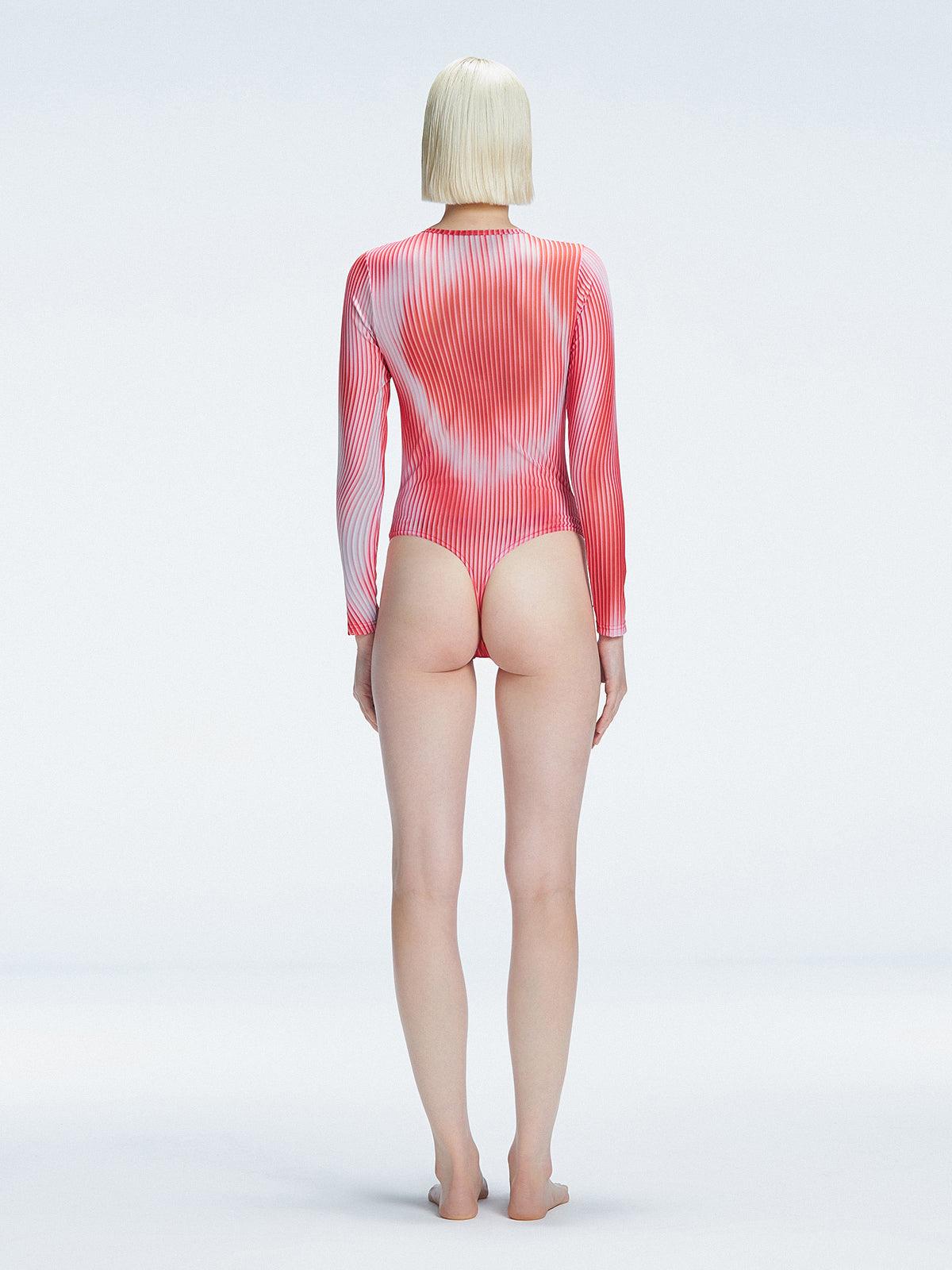 Back view of model wearing Mireya Red Optical Bodysuit, highlighting the sleek silhouette and long sleeves.
