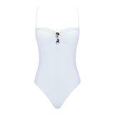 "Zephyrine White Swimsuit laid flat, showcasing the removable straps, buckle, and ruched chest detail."
