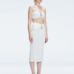 Side view of model showcasing the ruched front and sleek silhouette of the Lane Top and Esmeralda White Midi Skirt.
