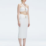 Side view of model showcasing the ruched front and sleek silhouette of the Lane Top and Esmeralda White Midi Skirt.
