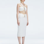 Side view of model showcasing the one-shoulder design and ruched front detail on the Lane White Top.
