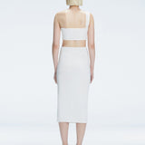 Back view of model wearing Lane White Top, highlighting the sleek one-shoulder silhouette.
