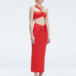 Side view of model showcasing the ruched front and sleek silhouette of the Lane Top and Esmeralda Red Midi Skirt.
