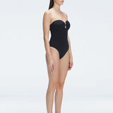 "Side view of the removable straps and ruched chest detail on the Zephyrine Black Swimsuit, emphasizing its versatility."
