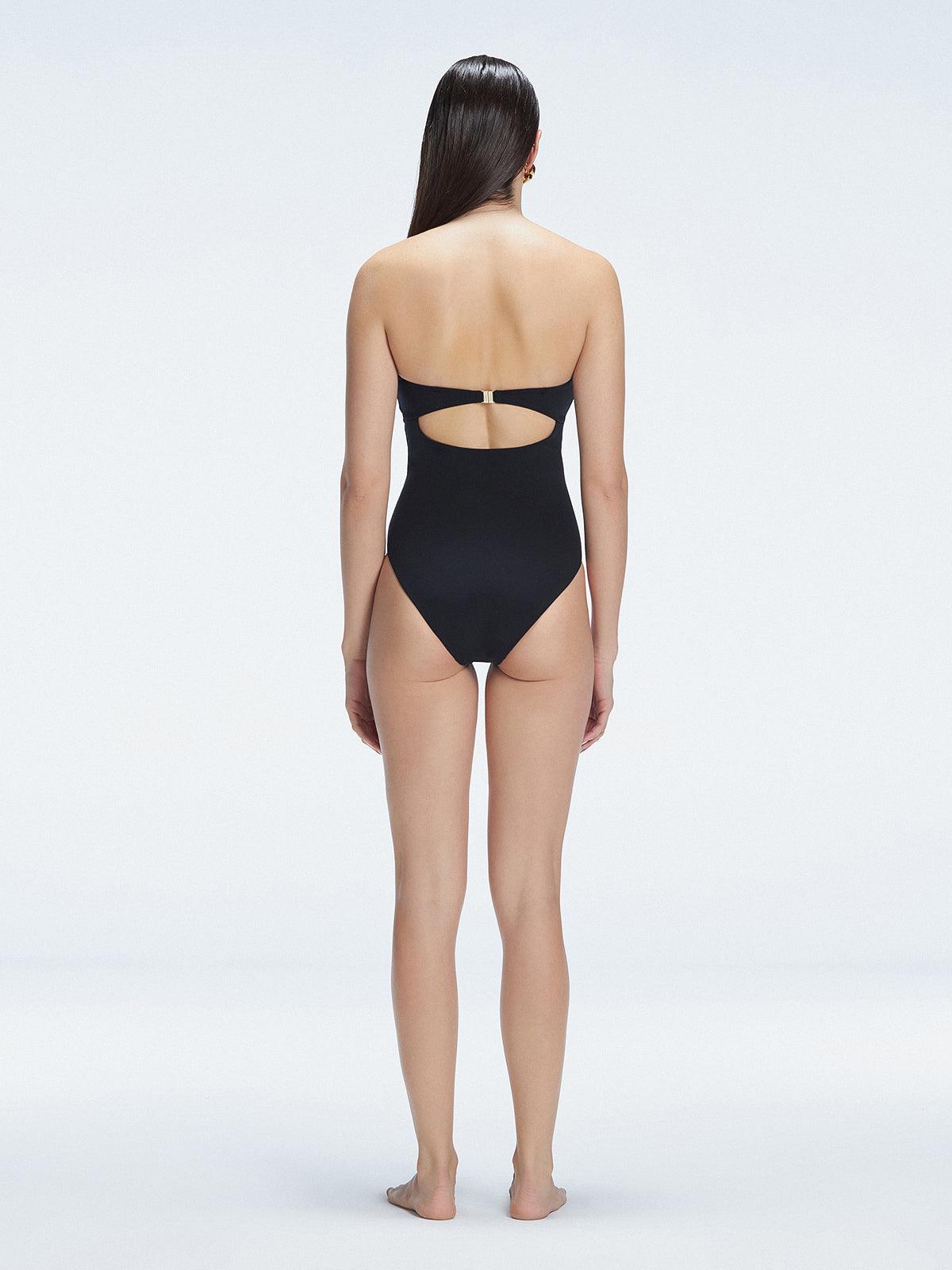 "Back view of the buckle and ruched chest detail on the Zephyrine Black Bandeau Swimsuit, showcasing its stylish design."
