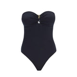 "Zephyrine Black Swimsuit laid flat, showcasing the removable straps, buckle, and ruched chest detail."
