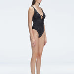 "Side view of the underwire and ruched front on the Emma Black Swimsuit, emphasizing the premium fabric and elegant design."
