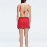 Back view of model wearing Siena Red Mini Skirt, highlighting the two-layered structure and flattering fit.
