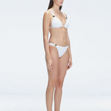 "Side view of the buckle detailing on the Zella White Bikini Top, emphasizing the chic, trendy design."
