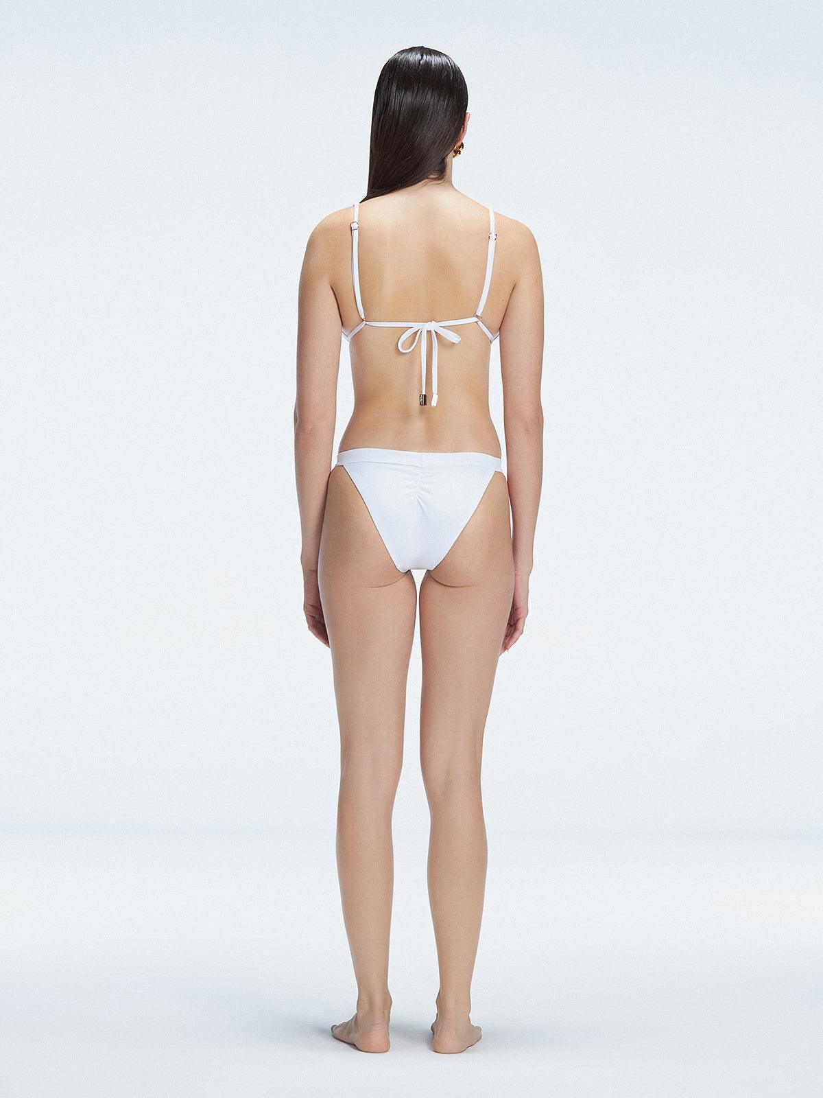 "Back view of the buckle straps and triangle neck design on the Zella White Bikini Top, emphasizing the fresh and trendy style."
