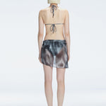 "back view of the printed fabric on the Evita Black Sarong, emphasizing its elegant design