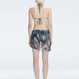 "back view of the printed fabric on the Evita Black Sarong, emphasizing its elegant design