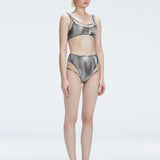 Side view of model showcasing the printed tulle and sleek high-waist fit on the Rosalind Black Bikini Set.
