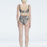 Back view of model wearing Rosalind Black Optical Bikini Set, highlighting the high-waisted fit and full coverage.
