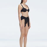 "Side view of the underwired V-neck and twist-front detail on the Madelyn Black Bikini Top and Dylan Bikini Bottom, emphasizing its elegant design."
