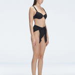 "Side view of the Dylan Black Bikini Bottom's fabric, showcasing the softness and durability of the Italian material."
