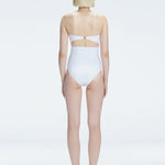 Back view of model wearing Ursula White One Piece swimsuit, highlighting the sleek strapless silhouette.
