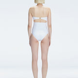 Back view of model wearing Ursula White One Piece swimsuit, highlighting the sleek strapless silhouette.
