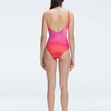 "Model showcasing the back of the Solene Gradient Swimsuit, highlighting the sleek fit and elegant one-shoulder design."
