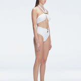 "Side view of the buckle detailing on the Meredith White Halter Neck Bikini Set, emphasizing the chic, trendy design."
