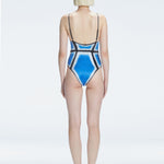 Back view of model wearing Seraphina Blue Optical One Piece, highlighting the sleek fit and moderate coverage.
