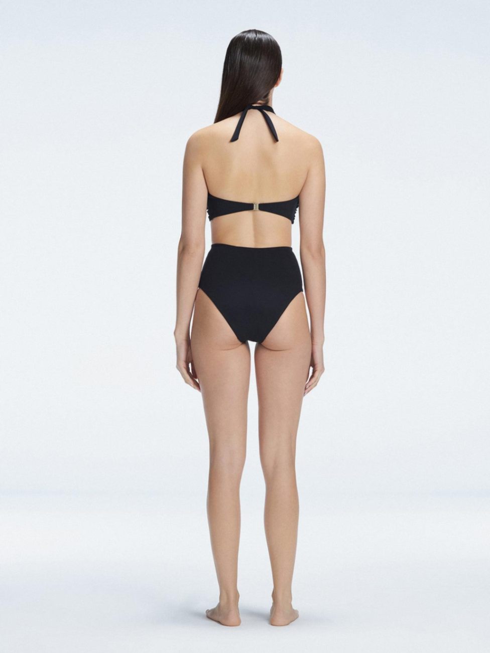 "Back  view of the buckle detailing on the Meredith Black Halter Neck Bikini Bottom, emphasizing the chic, trendy design."

