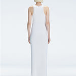 Back view of model wearing Louisa White Maxi Dress, highlighting the high neck and sleek silhouette.
