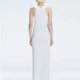 Back view of model wearing Louisa White Maxi Dress, highlighting the high neck and sleek silhouette.
