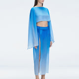 Side view of model showcasing the breathable mesh and chic silhouette of the Samantha BlueCrop Top.

