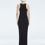 Back view of model wearing Louisa Black Maxi Dress, highlighting the high neck and sleek silhouette.
