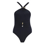 "Lyra Black Swimsuit laid flat, showcasing the underwire design, ruched detailing, and high-quality Italian fabric."
