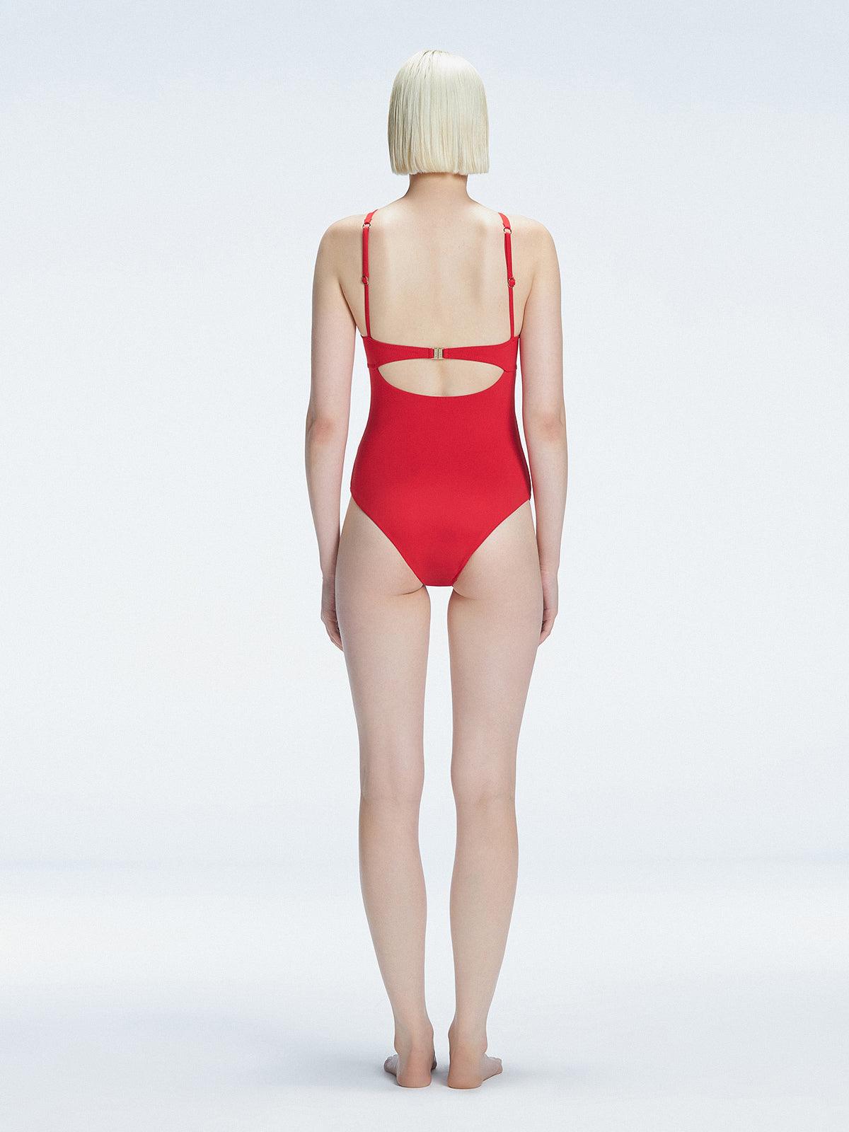 Model showing the back of the Lyra Red Swimsuit, revealing the sleek fit and moderate coverage.