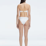 "Model wearing the Ilana White  Bikini Set from the back, showcasing the elegant bandeau design and adjustable straps."

